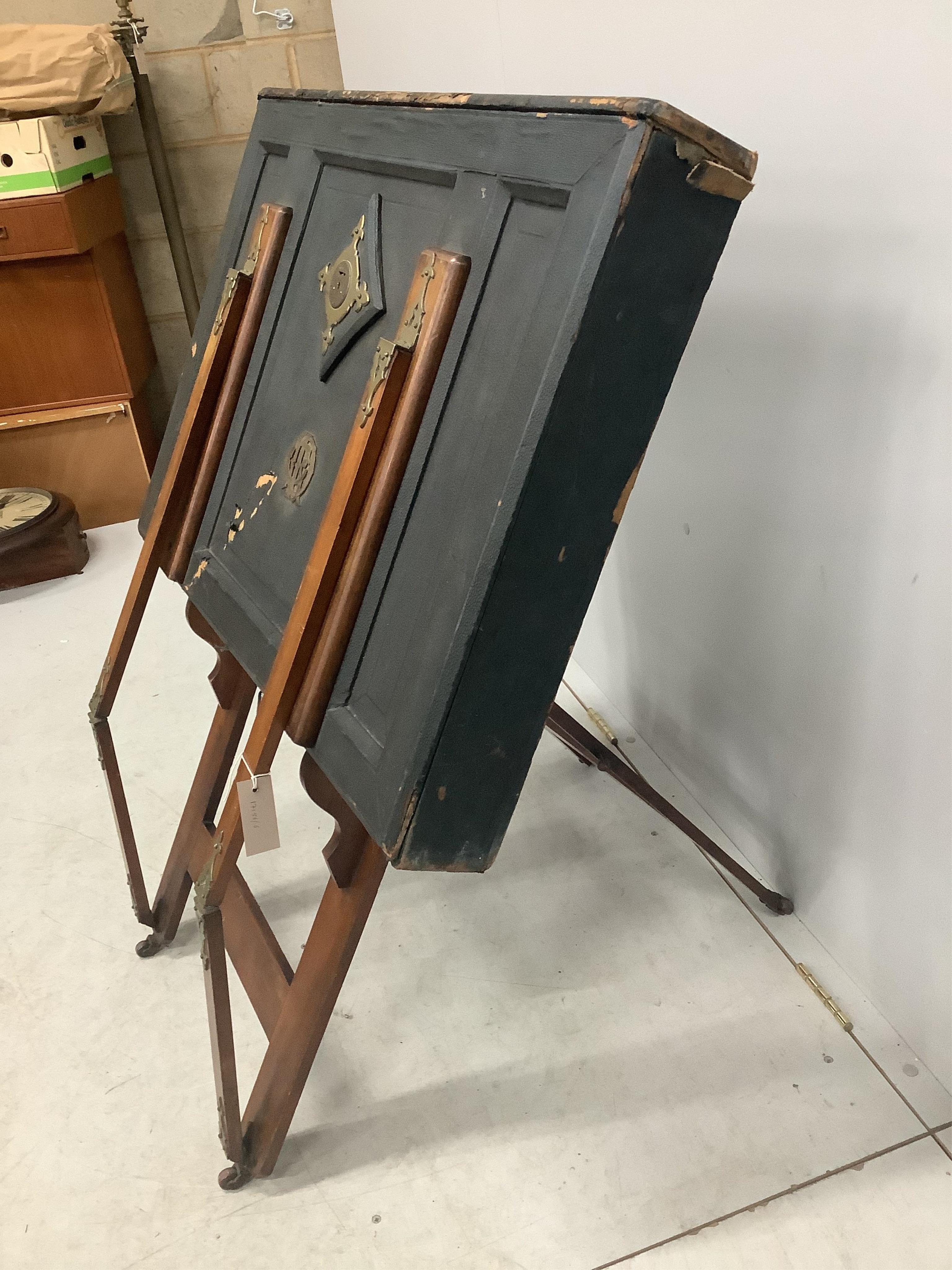 A Victorian brass mounted portfolio stand by Slade Bros. London, width 86cm. Condition - poor to fair